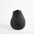 Gaia Vase Black- Tall. The Gaia vases have a matte finish with a glossed glaze inside. Its unbalanced shape makes for unique curves from all angles. Can be used to display flowers or on its own.  Available in three sizes in black.